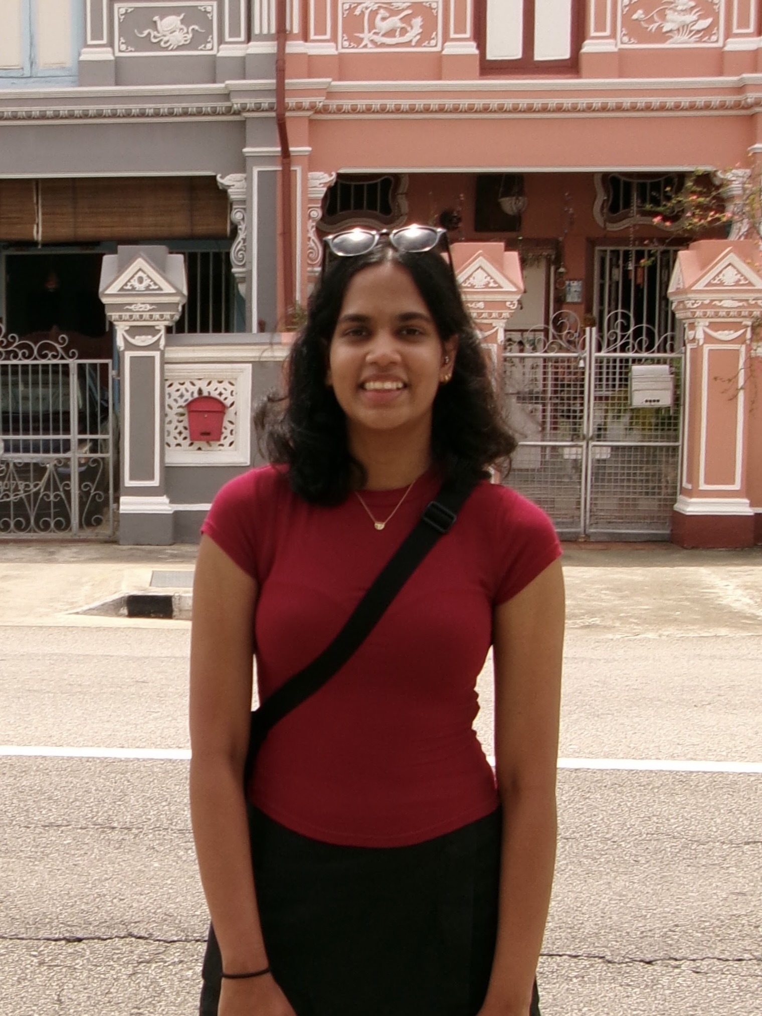 Me standing in front of the coloured houses in Singapore.